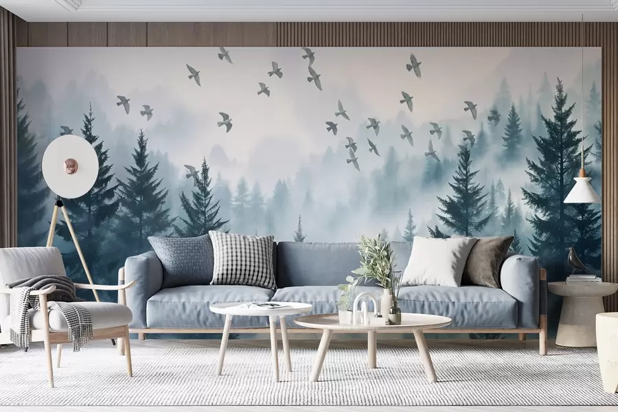 murais de parede Floresta tranquila e enevoada com árvores em tons de azul e um bando de pássaros voando no céu  w08664